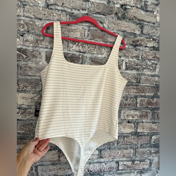 Express NWT cream with thin black stripe body suit. Waited to long to return - Picture 3 of 7